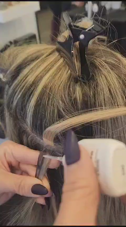 ColdHair stylist applying the hair joiner during installation